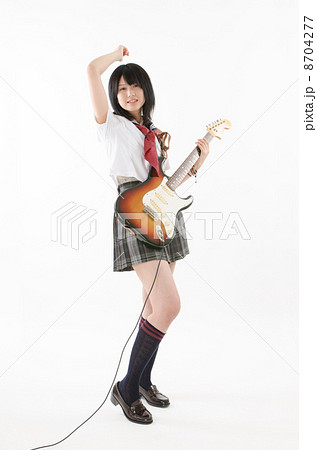 女子高生 女性 10代 エレキギターの写真素材