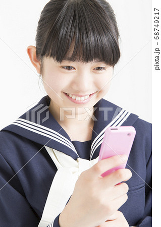 ガラケー 学生の写真素材