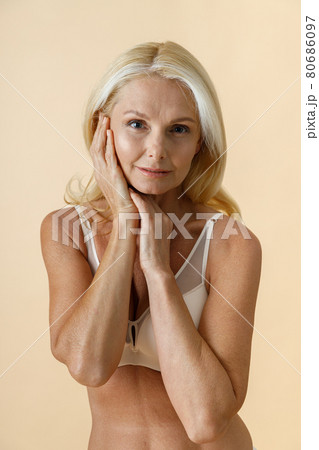 Natural Mature Blonde Woman in Underwear with Fit Body and Glowing