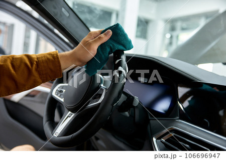 Closeup leather car interior cleaning with foam detergent and