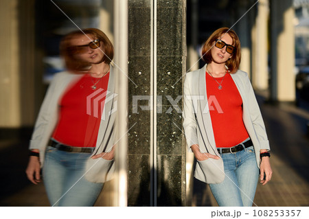 Redhead cute young hipster woman in stylish T-shirt in trendy