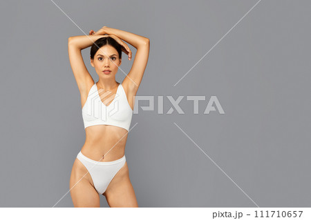 A young woman in red lingerie standing in the - Stock Photo [79843273] -  PIXTA